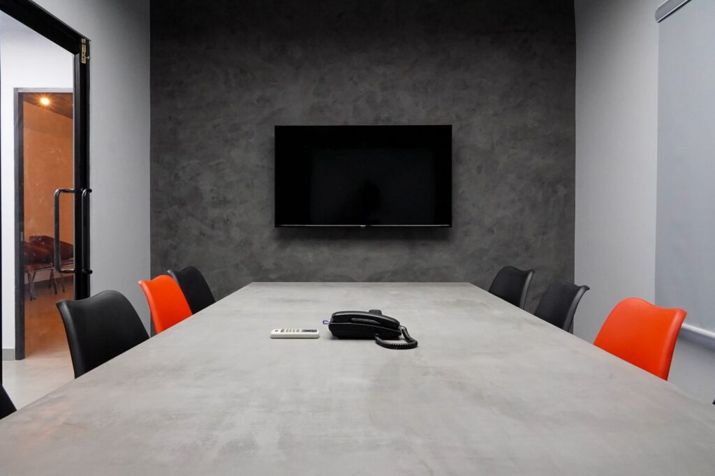 Meeting room with a large wall-mounted screen